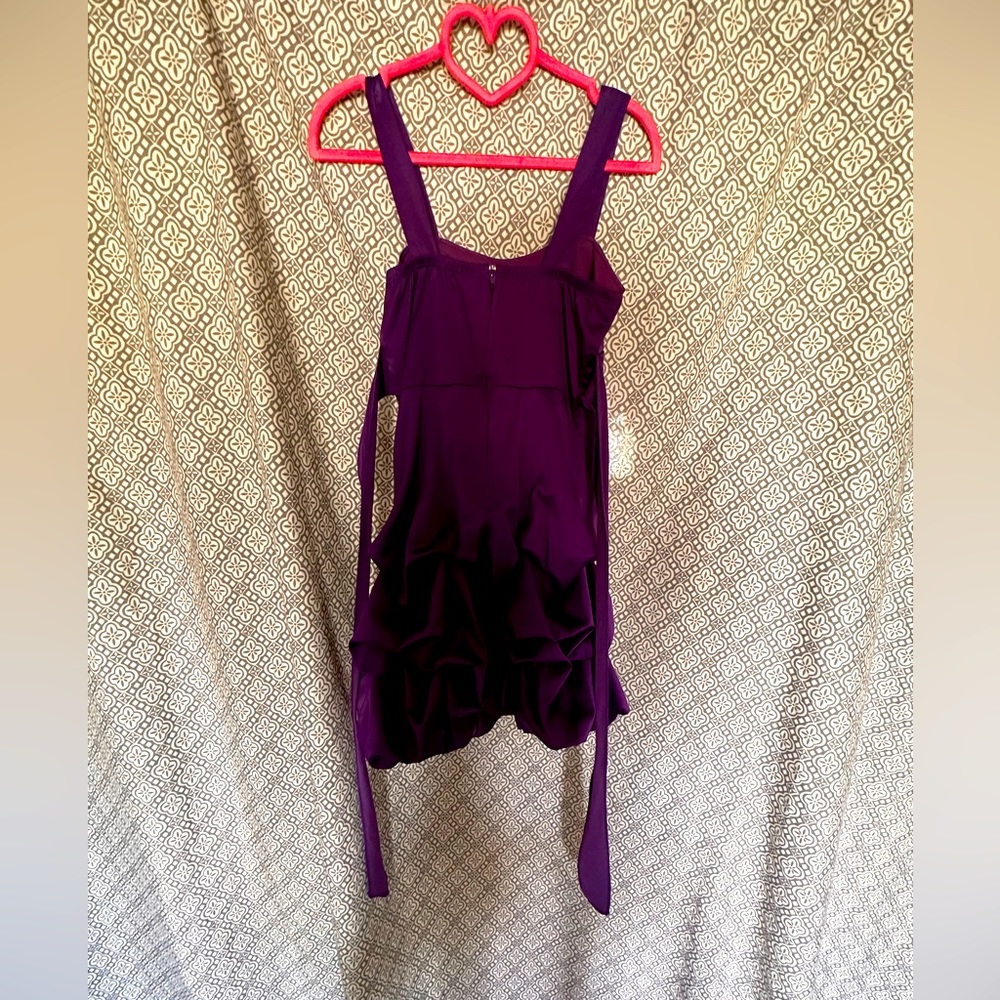 I am sellingA purple dress rosette